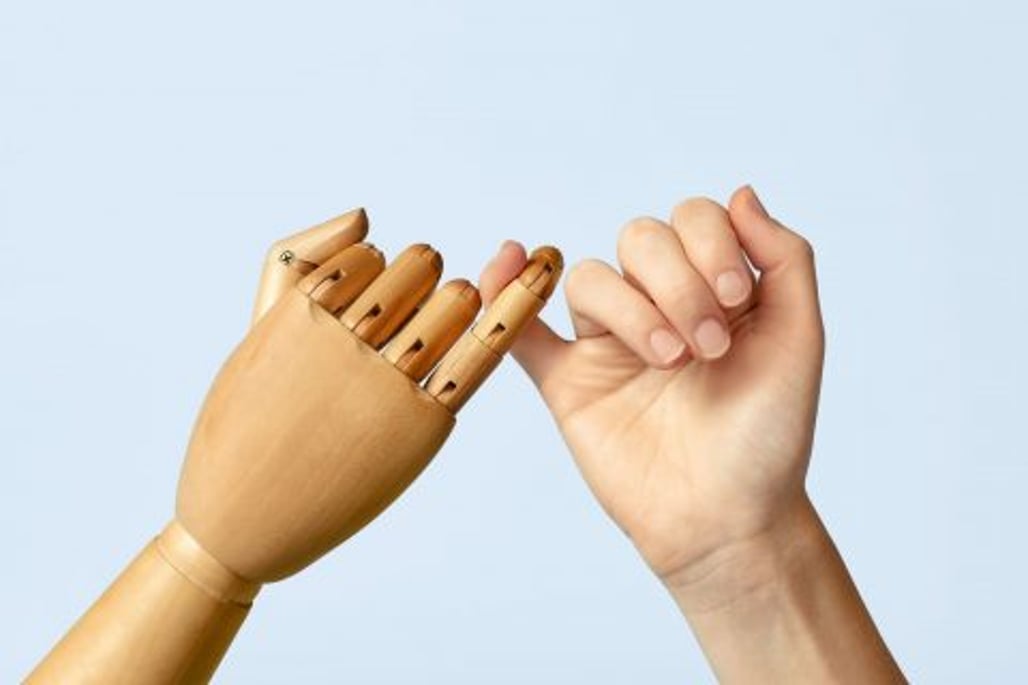 two hand holding pinky fingers