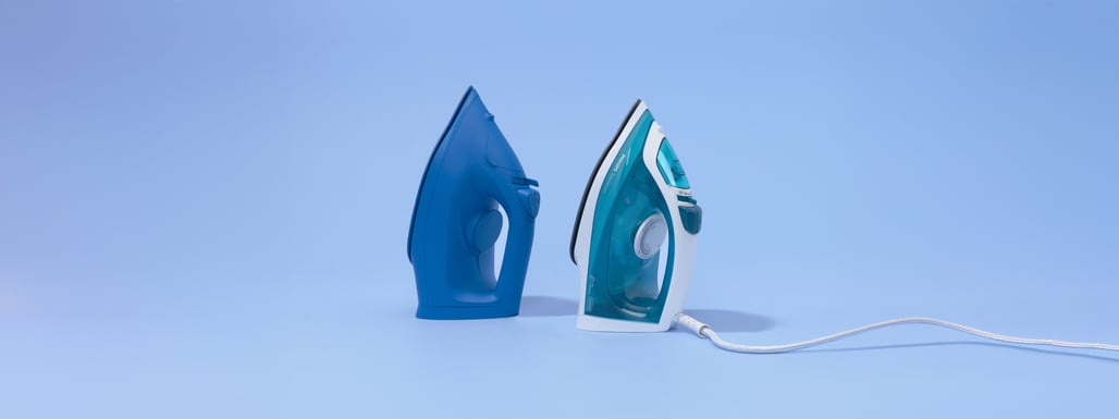 two irons, one of which is a branded iron