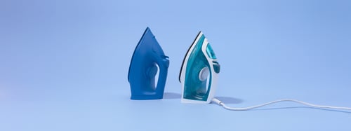 two irons, one of which is a branded iron